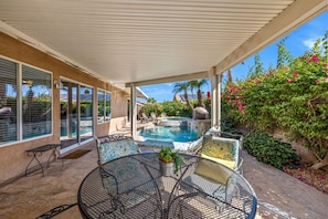 Outdoor dining area in the shaded patio area