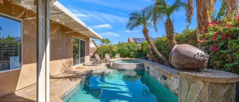 Private and heated swimming pool surrounded by landscape