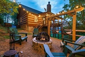 Relax in our private outdoor backyard with a FirePit and a Pergola with Hanging Egg Chairs.