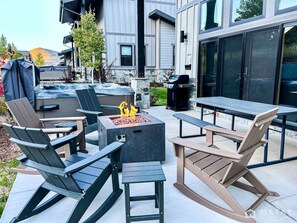 Enjoy a cozy evening under the stars with our outdoor fire pit featuring a stone pellet burner.