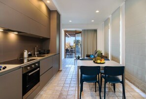 Kitchen area with table.