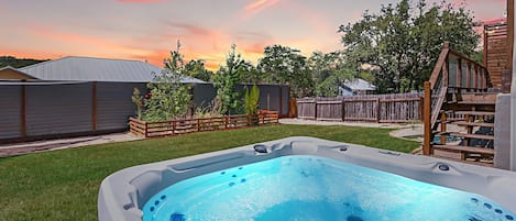 Unwind under the twilight sky in the private hot tub