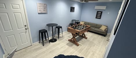 Gameroom with foosball and 2 full size arcade games
