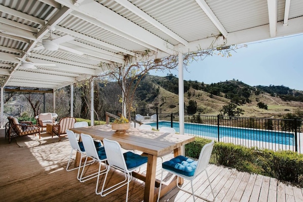 Dine out on the deck with a large alfresco table and views of the surrounding landscape.
