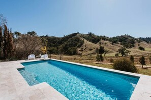 The sparkling private pool makes it easy to cool off in the warmer months amongst the peacefulness of rolling hills.
