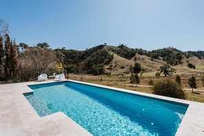 The sparkling private pool makes it easy to cool off in the warmer months amongst the peacefulness of rolling hills.
