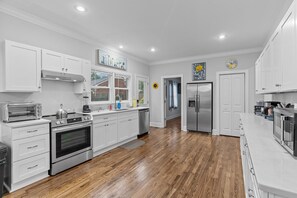 pristine kitchen with tons of storage and counter space