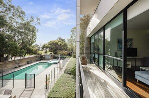 Balcony and view of pool & spa from apartment
