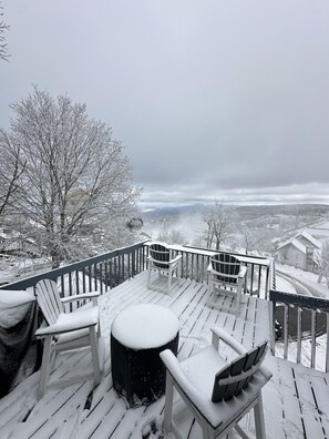 Sit by the fireplace to catch a view of the slopes and scenery.  