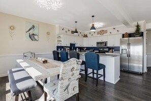Breakfast bar and dining area with stunning beach views.
