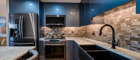 Large Kitchen Area with Granite Countertops