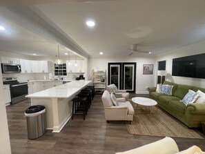 Large kitchen w quartz counter tops and bar w nespresso and keurig machines