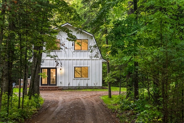 Contemporary cabin nestled in the woods. Ready for relaxation.