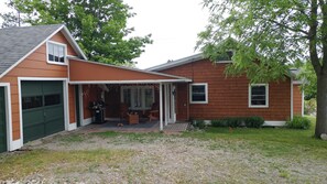 covered porch at entry off of driveway