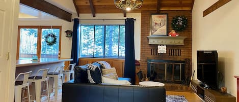 Cozy cabin condo has all the comforts of home, & a ski lift 30' from the deck.