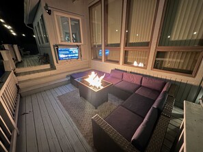 Outdoor fire table and flat screen televisio