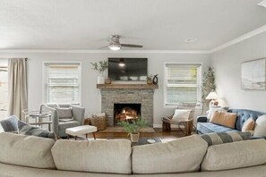 Large living room with 2 sofas and 3 comfortable chairs. Plenty of seating for everyone. 