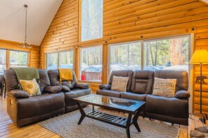 Comfy & bright living area with tons of windows. You might see a moose or a fox!