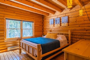 Bedroom 2 of 2 on the main level of the cabin. Queen size bed and large TV