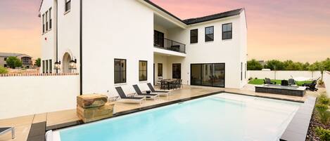 Largest pool in community, hot tub, fire pit, lawn games, fully stocked kitchen.