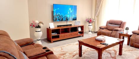 Livingroom with 7 seater sofaset plus 65” 4k smart tv with soundbar