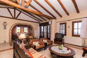 Living room with traditional decoration on the furniture and the roof