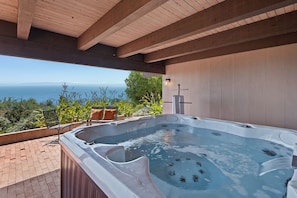 Covered hot tub with unobstructed ocean views