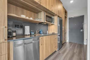 The fully stocked kitchen has stainless steel appliances, Nespresso, a toaster oven, and basic cookware so you can easily prepare delicious meals.