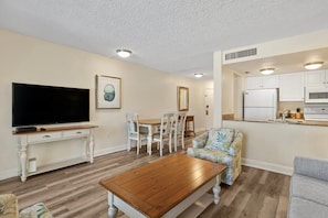 Dining are and fully equipped kitchen border living room