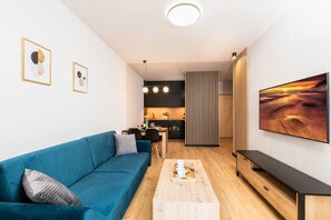 Sofa in the living room of the Hermoso apartment