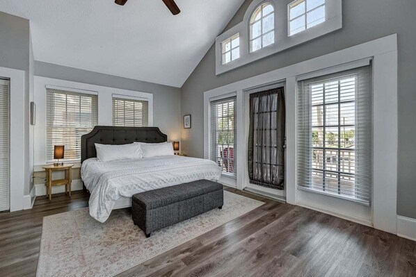 This bedroom has an attached balcony.