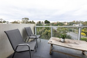 Enjoy balcony views and fresh air from the comfort of your own quaint balcony.