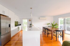 Air-conditioned dining area and fully equipped kitchen.