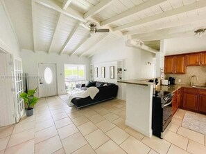 Open-Concept Living: Our living room seamlessly flows into a well-equipped kitchen, making it perfect for socializing.