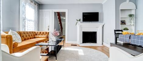 Living room with cozy couch and fireplace