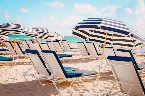 On the beach, beach cabanas, sun loungers