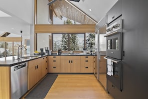 Beautiful gourmet kitchen five burner gas stove. Modern appliances for all your cooking needs.