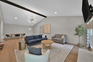 Get cozy on the couch, eat a delicious meal at the table, and be with your whole family in this open concept space!  

The TV is smart so bring your favorite logins!

*The ceiling light has since been changed to a fan