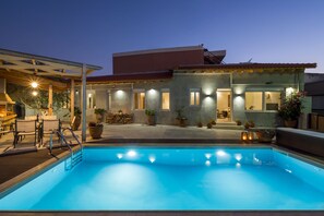 A serene evening dip in our illuminated pool – where relaxation meets enchantment.