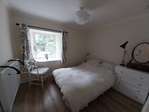 The cosy bedroom has a double bed and warm feather duvet.