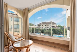 Charming balcony furniture, and from where you can enjoy beautiful views of the pool and the park. (2)