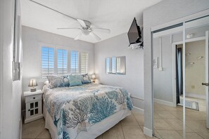 Awaken refreshed after a night in this oceanfront primary bedroom.