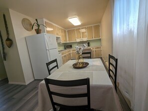 Fully-equipped kitchen and dining area.