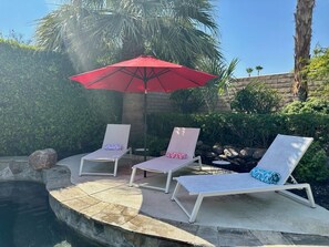 3 chaise lounges pool side