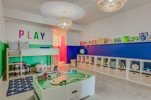 The playroom of your kiddos dreams - stocked with legos, a Melissa & Doug train set, tons of toys and books. It's sure to keep the little ones entertained for hours! 